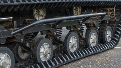 The wheels and track of a small all-terrain vehicle. Tracks of all-terrain cross-country vehicle. Adventure concept.