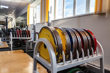 Gym. Sports equipment. Discs for rod on the rack