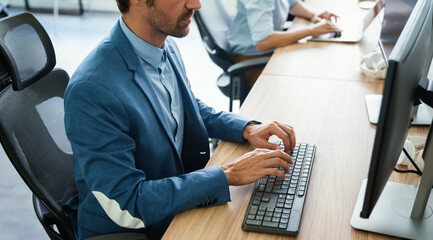 Software engineers working on project and programming in company