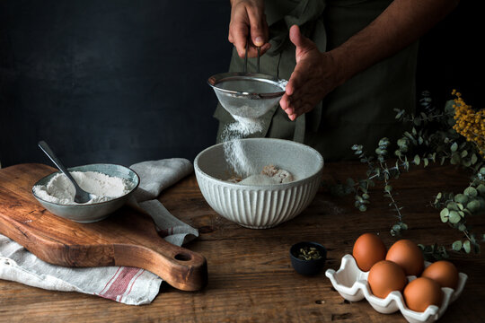 Crop anonymous man cooking pastry
