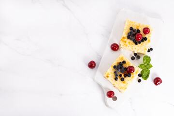Naklejka na ściany i meble Cottage cheese casserole with berries.Top view with copy space