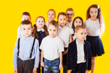 Happy school kids are ready for education. School children in uniform with backpacks going to class