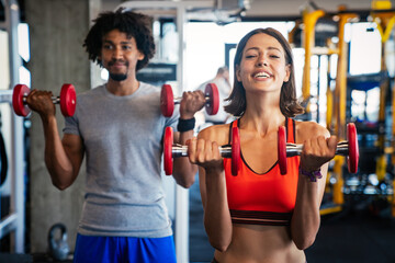 Picture of cheerful fitness team exercise together in gym