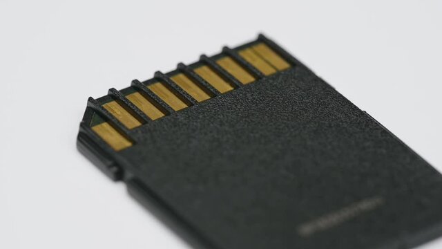 clips video 4k and full HD of memory SD card isolated on clean background this sd card for various computer, digital camera and smart mobile phone devices.