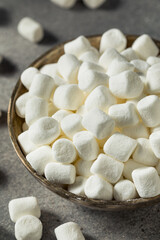 Fototapeta na wymiar Unhealthy Sugary White Mini Marshmallows