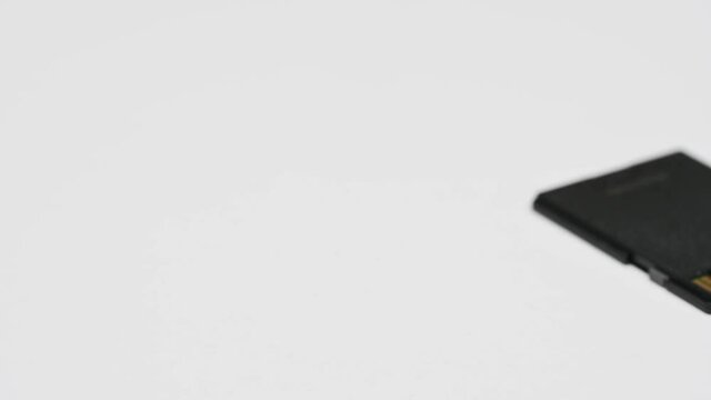 clips video 4k and full HD of memory SD card isolated on clean background this sd card for various computer, digital camera and smart mobile phone devices.