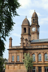 Fototapeta na wymiar Clock & Towers on 19th Century Stone Public Building 
