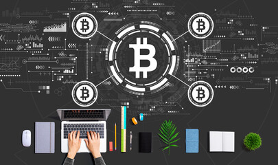 Bitcoin theme with person using a laptop