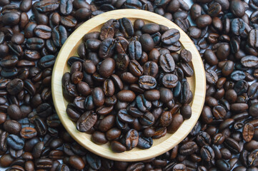 Top view of coffee bean brown roasted on wooden plate