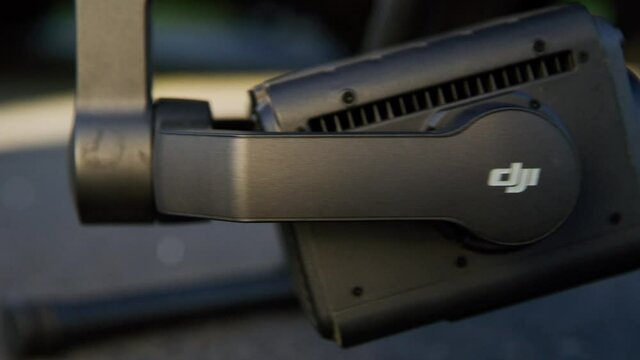 preparing a big drone RTK for flying over a roof to measure its size, changing Batteries, unfold the wings, camera 