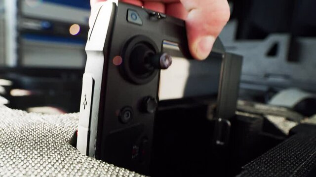 preparing a big drone RTK for flying over a roof to measure its size, changing Batteries, unfold the wings, camera 