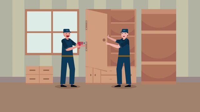 Two carpenters assembling a wardrobe in workshop