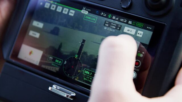 preparing a big drone RTK for flying over a roof to measure its size, changing Batteries, unfold the wings, camera 