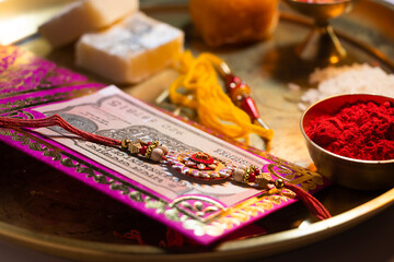 Naklejka na ściany i meble Close-up Rakhi kept in a decorative thali on the occasion of Rakshabandhan