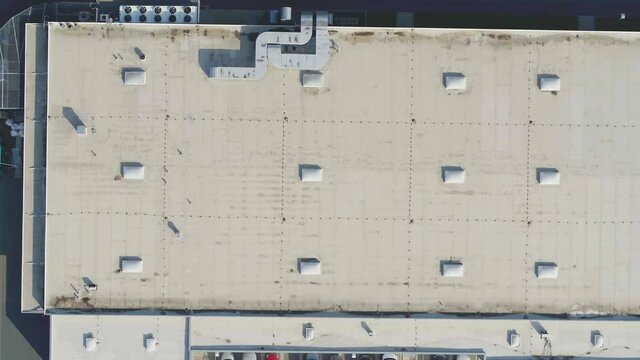 Big drone flying over a roof to inspect and measure it
