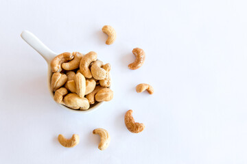 Cashew nut on white background. Healthy grains.