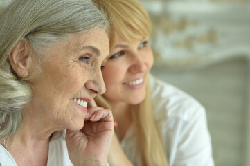 Portrait of Senior woman with daughter at home
