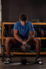 Obraz na płótnie Canvas black latino man works out at the gym