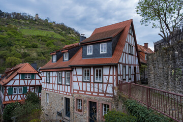 View towards the half-timbered houses in Heppenheim / Germany in the Odenwald with the Starkenburg in the background 