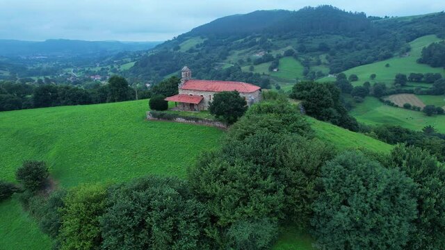 Aerial view from a drone of the hermitage of San Vicente, between Esles and Lloreda in the municipality of Santa Mar&iacute;a de Cayon in the Valles Pasiegos. Cantabria, Spain, Europe