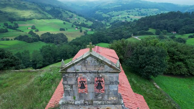 Aerial view from a drone of the hermitage of San Vicente, between Esles and Lloreda in the municipality of Santa Mar&iacute;a de Cayon in the Valles Pasiegos. Cantabria, Spain, Europe