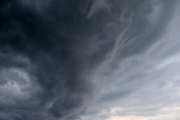 Storm hurricane blue leaden torn clouds on the horizon
