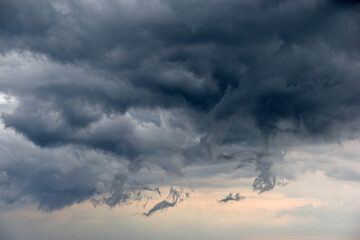 Storm hurricane blue leaden torn clouds on the horizon