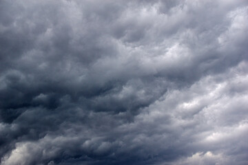 Storm hurricane blue leaden torn clouds on the horizon
