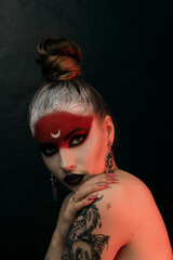 halloween make up sugar skull beautiful model with perfect hairstyle. Santa Muerte concept. Fashion retro toning