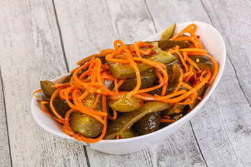 Pickled cucumbers with carrot and herbs