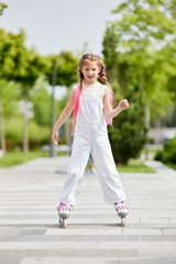 Cheerful little girl on roller skates with braided hair style