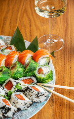 sushi and white wine in the restauran