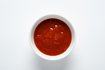 red sauce in the white bowl