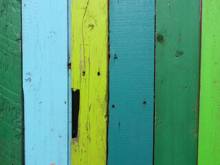 door made of multicolored shelfs painted blue and green