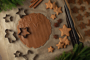 Christmas gingerbread dough in the cooking process. on a dark background