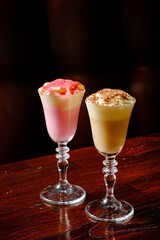 two cocktails on the wooden background