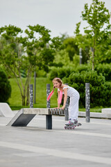 Cute little child girl on roller skates at park