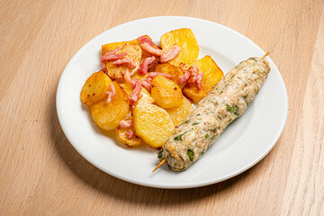 chicken kebab with fried potatoes