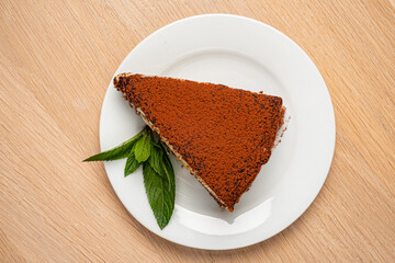 tiramisu cake on the wooden background