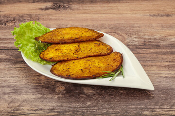 Baked potato with herbs and spices