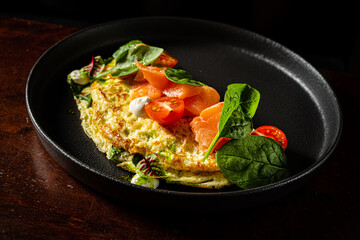 omelet with fresh vegetables and herbs