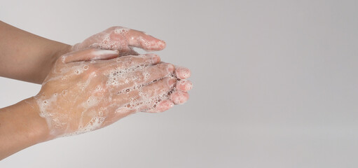 Hands washing gesture and foam bubble on white background.