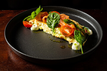 omelet with fresh vegetables and herbs