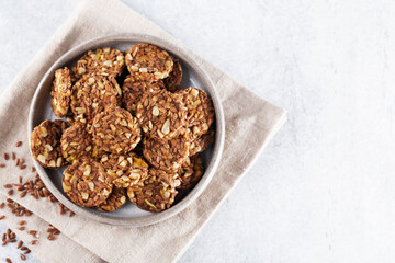 Energy cookies or crispbread (from sesame seeds, flax seeds and other cereals), top view