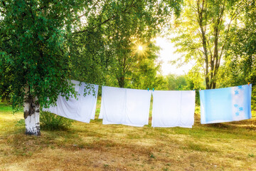 drying linen outdoors in the morning sun