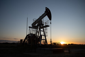 Oil Pump on orange sunset.