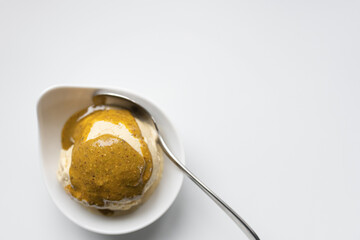 homemade pistachio ice cream with maple syrup, with pistachio sauce on top, gluten-free and sugerfree. Without colouring and artificial flavors!