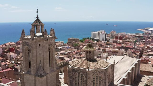 Aerial view Terragona Catalonia Spain. Ancient cathedral in the city center by the sea with beautiful old architecture, towers, red roofs.