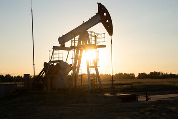 Oil Pump on orange sunset.