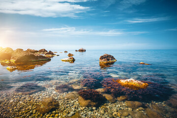 Fototapeta na wymiar Idyllic view of the Black sea and huge stone blocks in the bay.